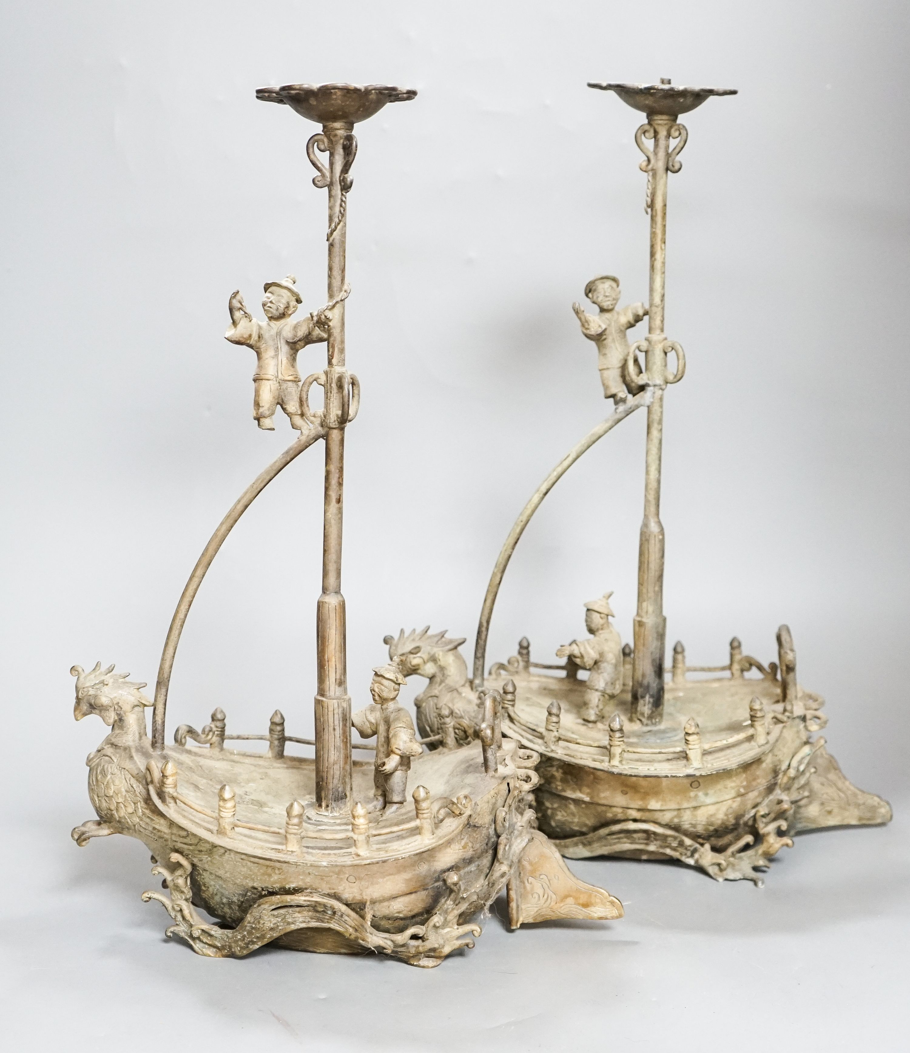 A pair of Chinese brass ‘ship’ lamp stands, 41cm